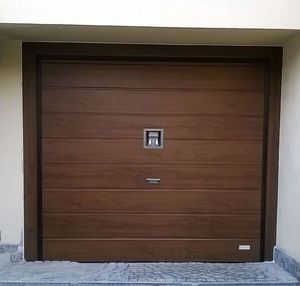 porte de garage sectionnelle / en métal / en mousse de polyuréthane / automatique