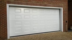 porte de garage sectionnelle / en métal / en mousse de polyuréthane / automatique