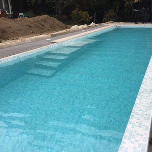 piscine semi-enterrée / en pierre / professionnelle / d'extérieur