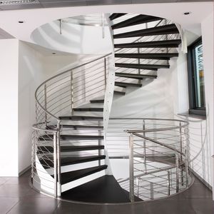 escalier en colimaçon / structure en acier inoxydable / marche en pierre / avec contremarche