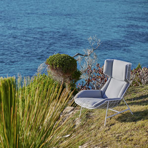 fauteuil contemporain / en tissu / en acier / avec repose-pieds