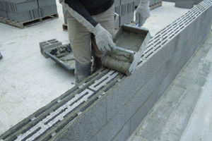 bloc de béton creux / pour mur porteur / à emboîtement / pose à joint mince