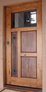 porte d'entrée / à pivot / en bois / en acier