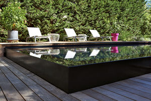 piscine semi-enterrée / en béton / miroir / d'extérieur