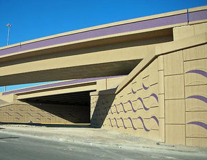mur de soutènement en béton armé / préfabriqué / finition pierre