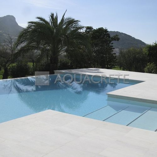 Revêtement de sol en ciment - AQUACRETE® - EDFAN EUROPA SL - en enduit / en quartz / pour extérieur