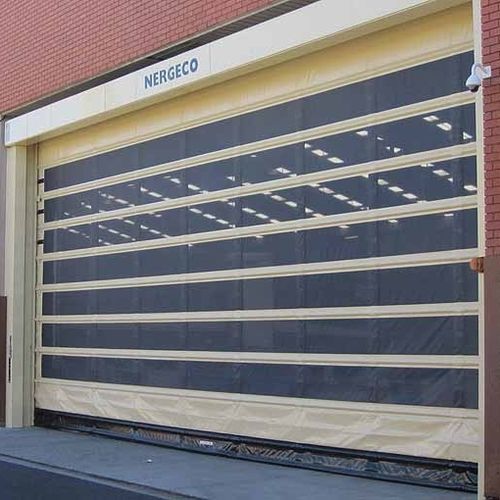 Porte industrielle sectionnelle - NERGECO - en métal / automatique / pour hangar