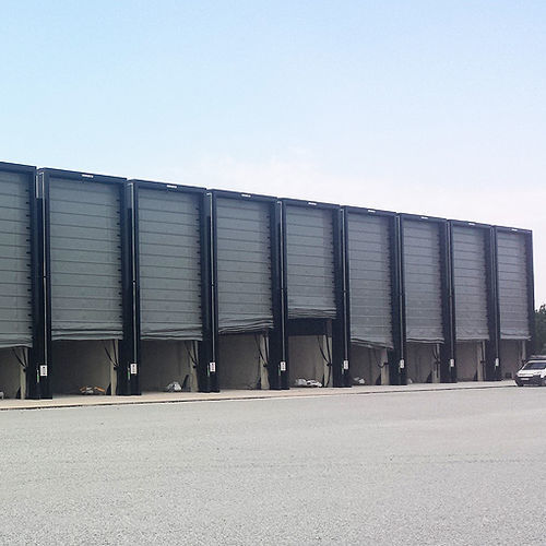 Porte industrielle pliante - NERGECO - autoportante / en acier / grande hauteur