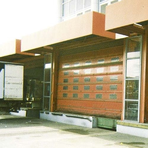 Porte industrielle sectionnelle - NERGECO - en métal / de sécurité / automatique