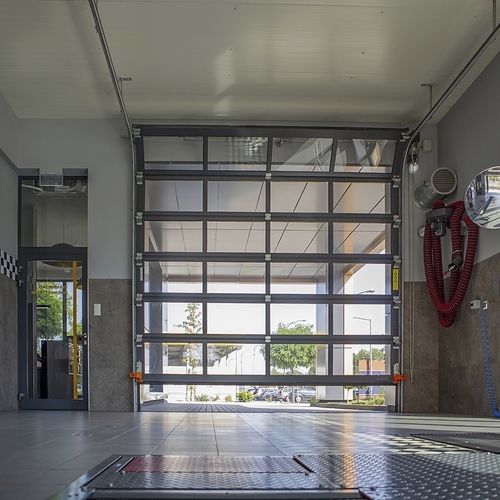 Porte industrielle sectionnelle - MakroPro 2.0 series - WISNIOWSKI - en métal / automatique / de sécurité