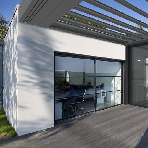Véranda en verre - EXTENS'K - KAWNEER - en aluminium / avec volet roulant intégré / à portes coulissantes