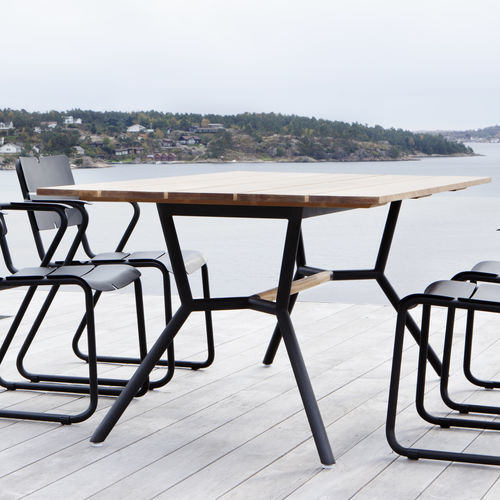 Table à manger contemporaine - REEF - OASIQ - en teck / aluminium / en acier inoxydable