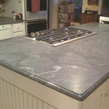 Plan de travail en granite - VIRGINA MIST - WALL GRANITE SERVICE SRL - de cuisine / noir / à bords ronds