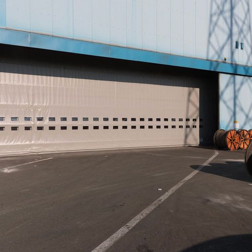 Porte industrielle à empilement - SAILDOOR® - Apostoli Daniele - en acier galvanisé / en PVC / résistante au vent