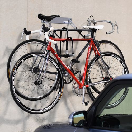 Range-vélo mural - PARALLEL RACK - Madrax - pour garage / en acier à revêtement par poudre / professionnel