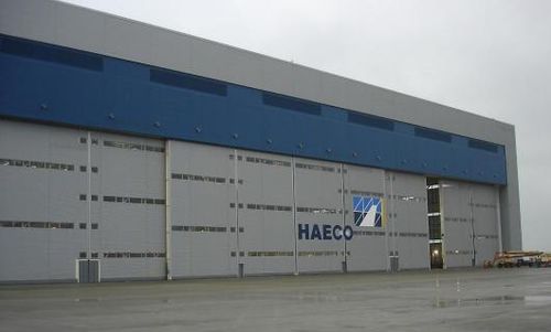 Porte industrielle coulissante - ESAVIAN : TYPE 126 - Jewers Doors - en acier / étanche / pour hangar