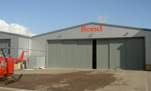 Porte industrielle coulissante - PHOENIX : KINGFISHER - Jewers Doors - en métal / de sécurité / haute performance