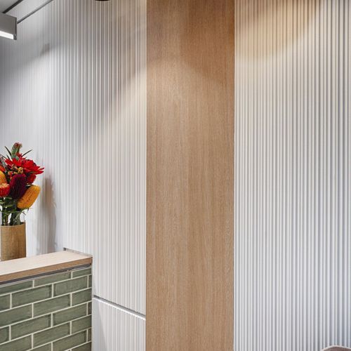 Panneau décoratif mural - CORRUGATED - STONINI - pour agencement intérieur / léger / coupe-feu