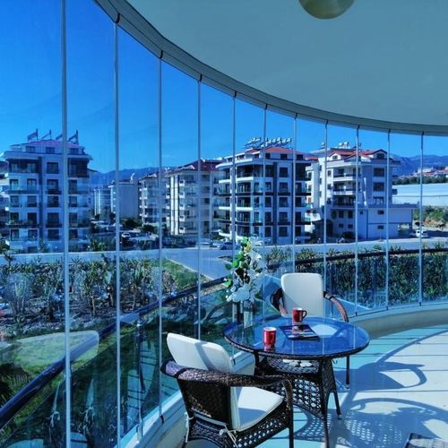 Fenêtre-balcon en verre - BKS balcony glazing systems - en aluminium / coulissante-empilable / acoustique