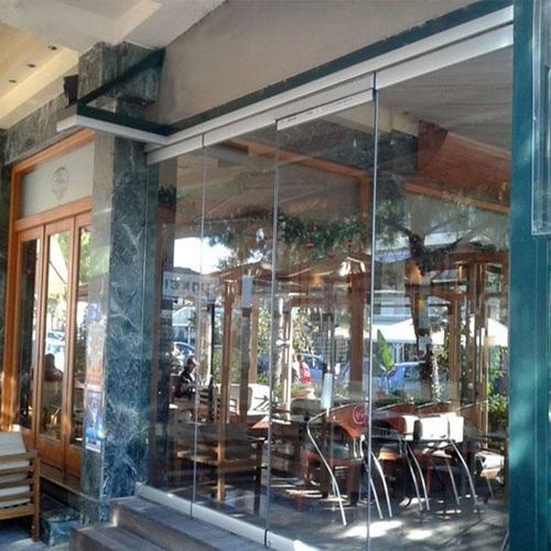 Mur-rideau en panneaux - Atrio Glass Doors - en aluminium et en verre / décoratif / transparent
