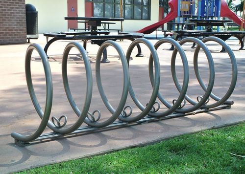 Range-vélo au sol - SPIRAL - CANTERBURY DESIGNS - pour espace public / en acier inoxydable / en aluminium