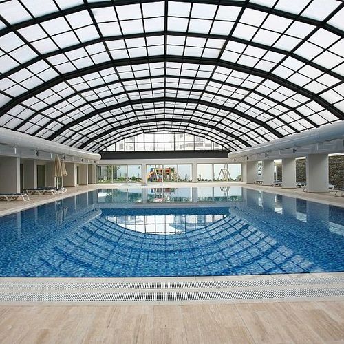 Toit vitré en aluminium - CLEARSKY - Evergreen Solutions - en polycarbonate / motorisé / escamotable