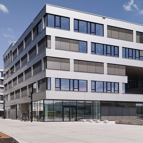 Bardage en panneaux - POSTAREAL FREIBURG - ALUCOBOND - en aluminium / en composite / à emboîtement