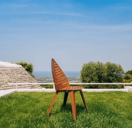 Chaise design original - LILA - Trackdesign - de jardin / en acier COR-TEN® / avec piètement en métal