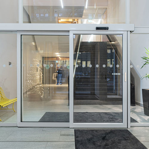 Système coulissant en aluminium - SL521 Telescopic - ASSA ABLOY Entrance Systems - pour porte en verre / coureurs cachés / professionnel