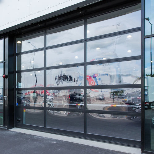 Porte industrielle sectionnelle - OH1042FG  - ASSA ABLOY Entrance Systems - en aluminium / automatique / résistante au vent