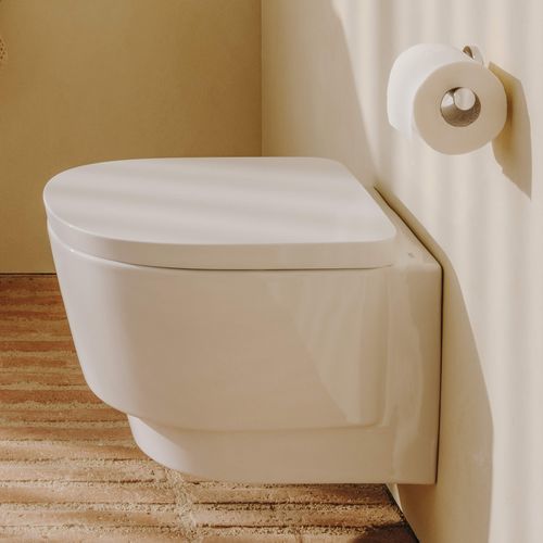 WC suspendu - TURA - ROCA - en céramique / résidentiel / rond