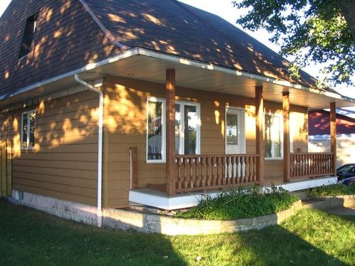 Bardage en lames - NOVIPLANK™ S8 - NOVIK - en polymère / rainuré / aspect bois