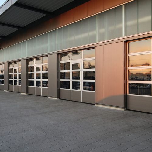 Porte industrielle battante - PASS AND SIDE - Novoferm - en aluminium / résistante au vent / antipanique