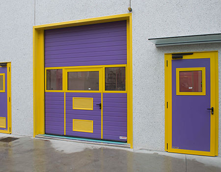 Porte industrielle sectionnelle - Moreschi Chiusure Industriali S.r.l. - en tôle d'acier / en acier galvanisé / en mousse de polyuréthane