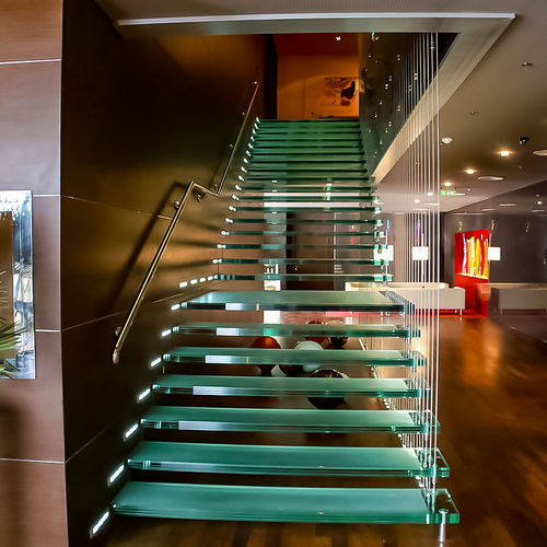 Escalier en colimaçon - Transparent Design SRL - à marches en verre / structure en acier inoxydable / structure en acier