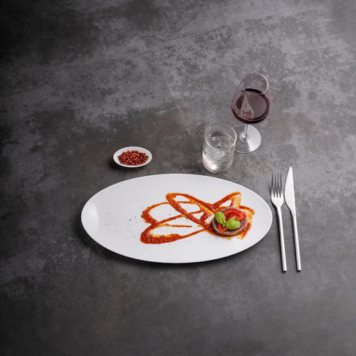 Assiette plate - Saturno Elliptical - COSTA VERDE - elliptique / en porcelaine / professionnelle