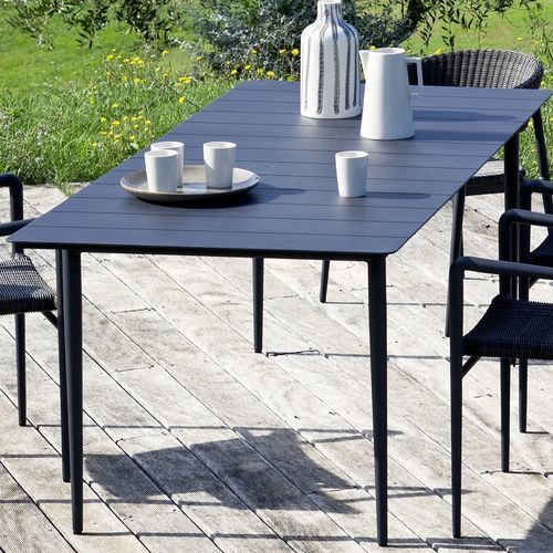Table contemporaine - EXPERIENCE - Unopiù - en fonte d'aluminium / en fibres synthétiques / avec piètement en aluminium