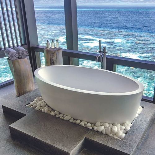 Baignoire ovale - MAYA - Dado Creations Pty (LTD) - en îlot / en Solid Surface / en fonte minérale