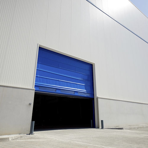 Porte industrielle à empilement - Manusa - en acier laqué / automatique / de sécurité