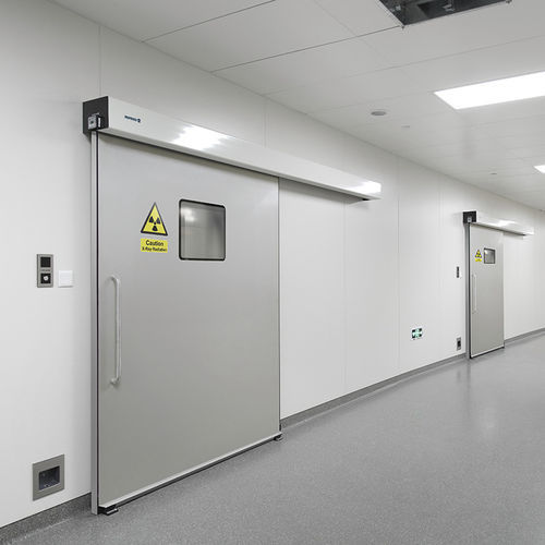 Porte industrielle coulissante - EMPLOMADA - Manusa - en acier inoxydable / en HPL / en plomb