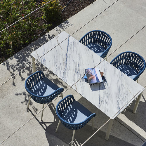 Table contemporaine - MINERAL - DRIGANI SRL - en pierre / avec piètement en acier à revêtement par poudre / avec piètement en caoutchouc