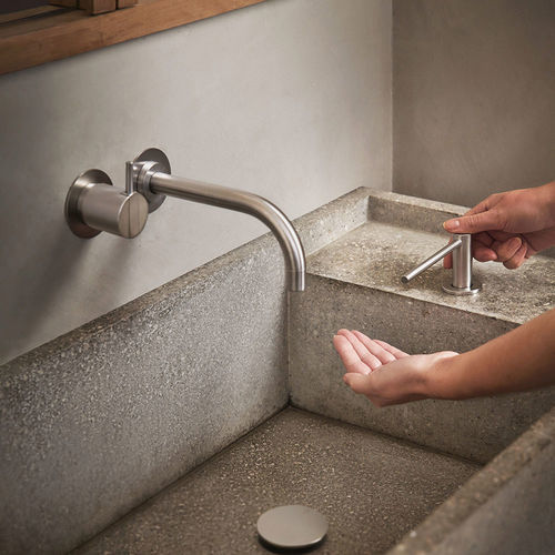 Mitigeur de vasque - 111 series - VOLA - mural / en acier inox / 2 trous