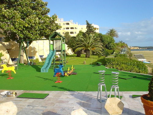 Revêtement de sol en caoutchouc - PLAYGROUNDS - ECOPOLIMER - pour aire de jeux / texturé / aspect béton