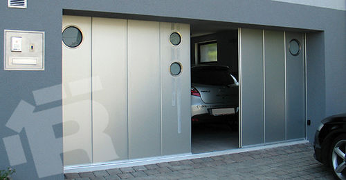 Porte de garage sectionnelle latérale - SSD - RYTERNA GROUP UAB - en métal / manuelle / isolante