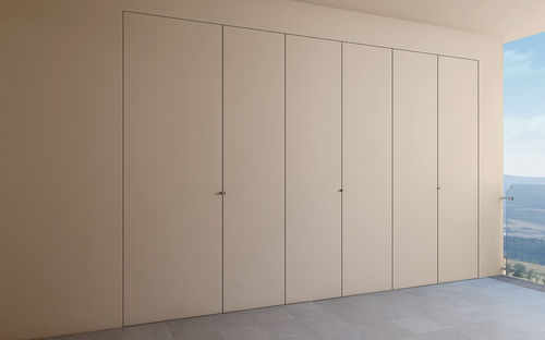 Porte de placard en bois massif - FILOPARETE - CIPRIANI SERRAMENTI - en aluminium / battante / pleine