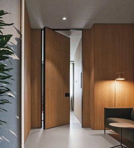 Porte d'intérieur - SYNUA - Oikos Venezia - en bois massif / à pivot / contemporaine