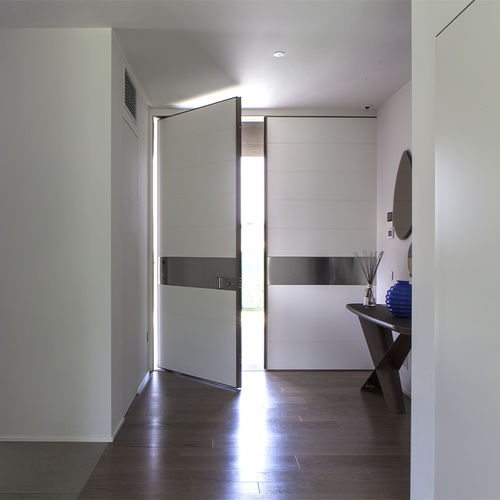Porte d'entrée - SYNUA WALL SYSTEM - Oikos Venezia - en acier / en acier corten / à pivot