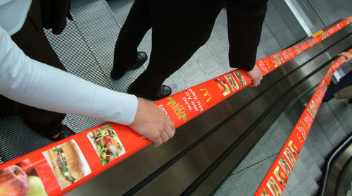 Main courante en métal - ADRAIL™ - EHC Global - avec impression publicitaire / pour escalator