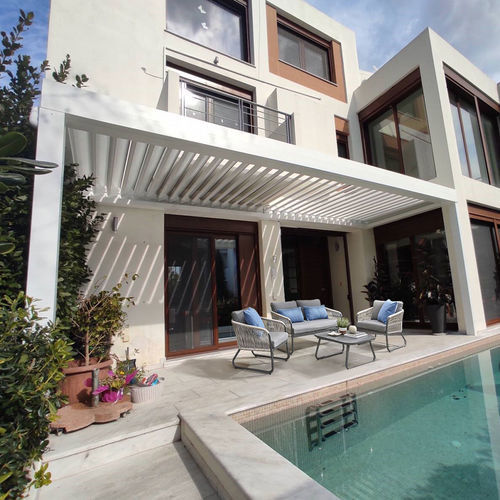 Pergola adossée - CospiBio  - COSPICON  SA - aluminium / à lames orientables / à lames brise soleil