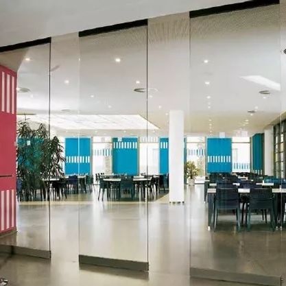Cloison coulissante-empilable - Opal - Apton Partitioning Limited - vitrée / en aluminium / professionnelle